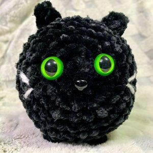 Super soft velvet back cat with cute green eyes.